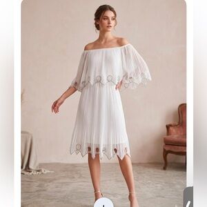 Chic Strapless White Dress with Cut-Out Detailsand studded accents. NWT